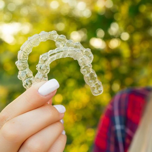 Lady shows off clear aligners
