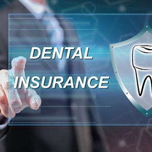 Emergency dentist in Dallas pointing to dental insurance graphic