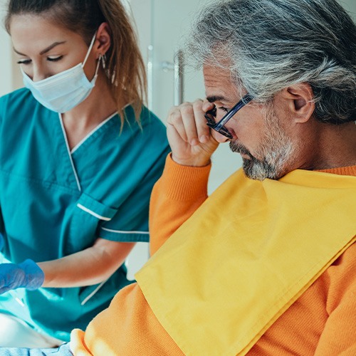 Dentist showing a man X-rays