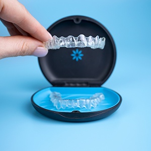 Taking Invisalign aligner out of its case