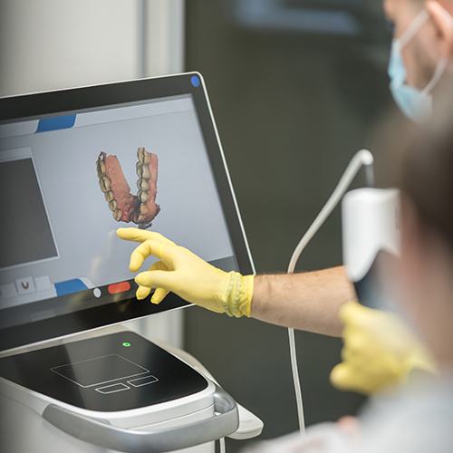 Dentist looking at digital impressions